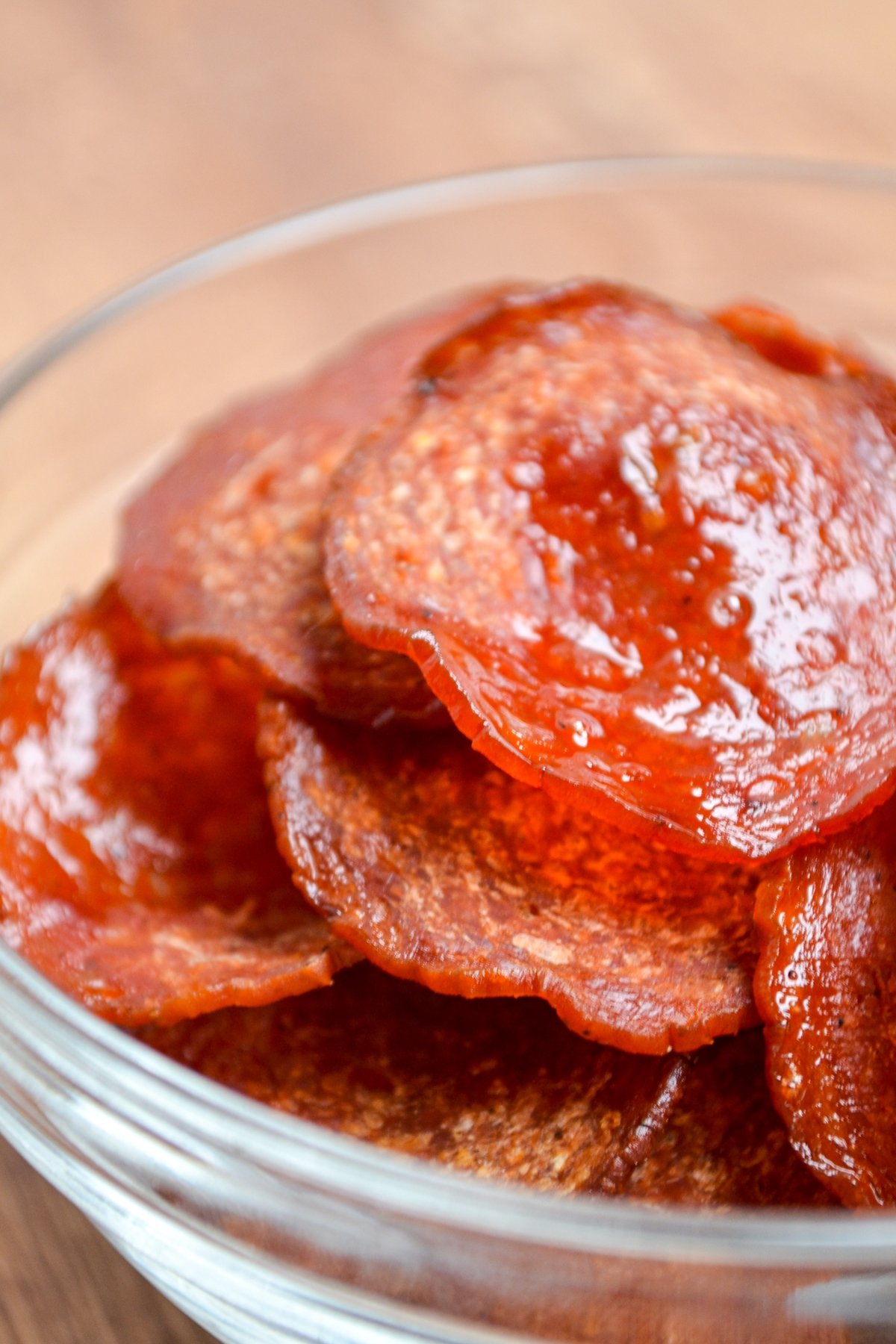 Air fryer pepperoni chips in a small snack bowl.