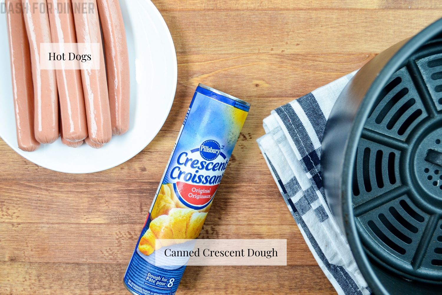 The ingredients needed to make air fryer pigs in a blanket: canned crescent dough and hot dogs.