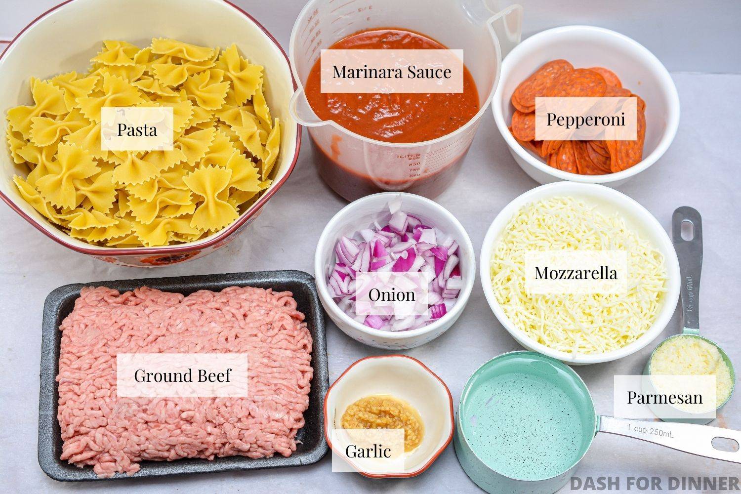 The ingredients needed to make a crock pot pizza casserole.