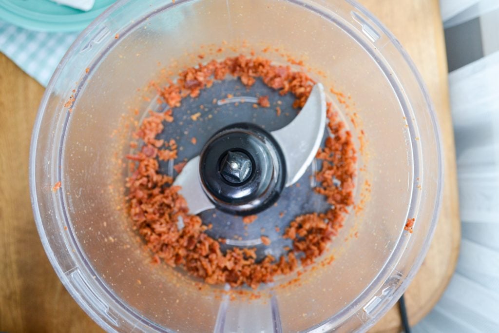 Bacon bits being processed in the food processor.