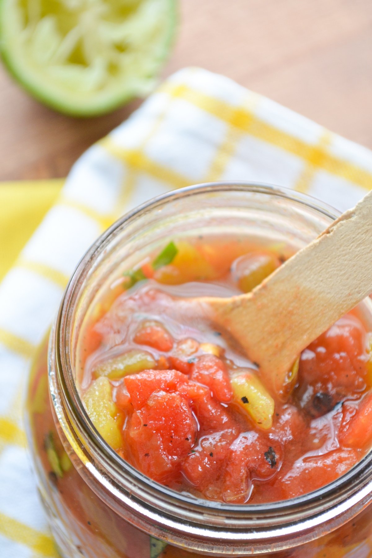 A homemade substitute for Rotel tomatoes and chilies in a glass jar.