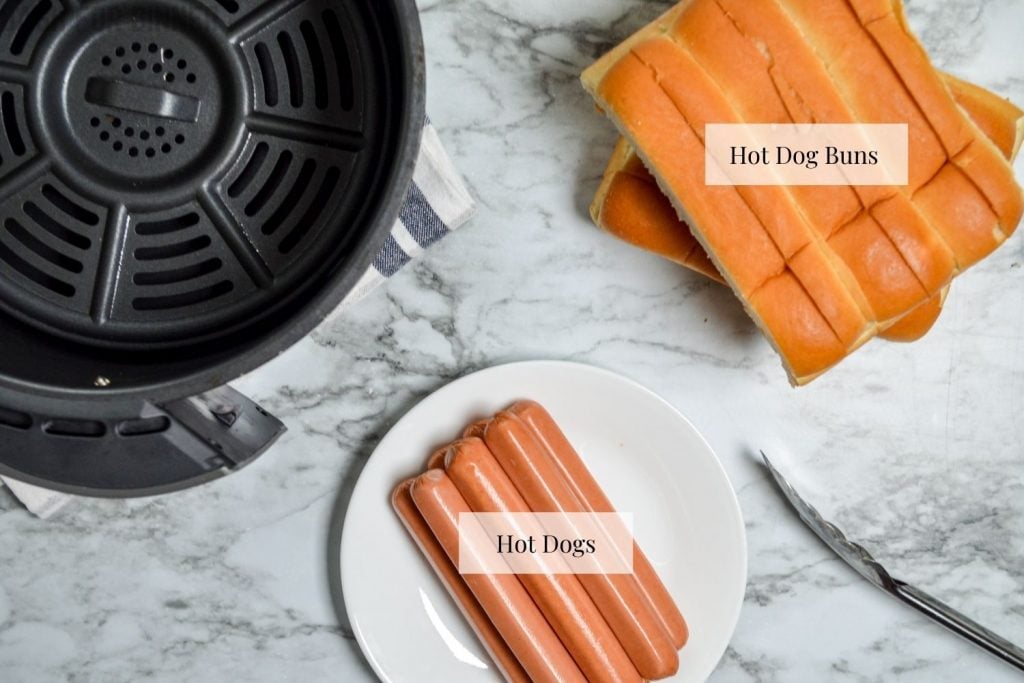 The ingredients needed to make air fryer hot dogs: hot dogs and hot dog buns.