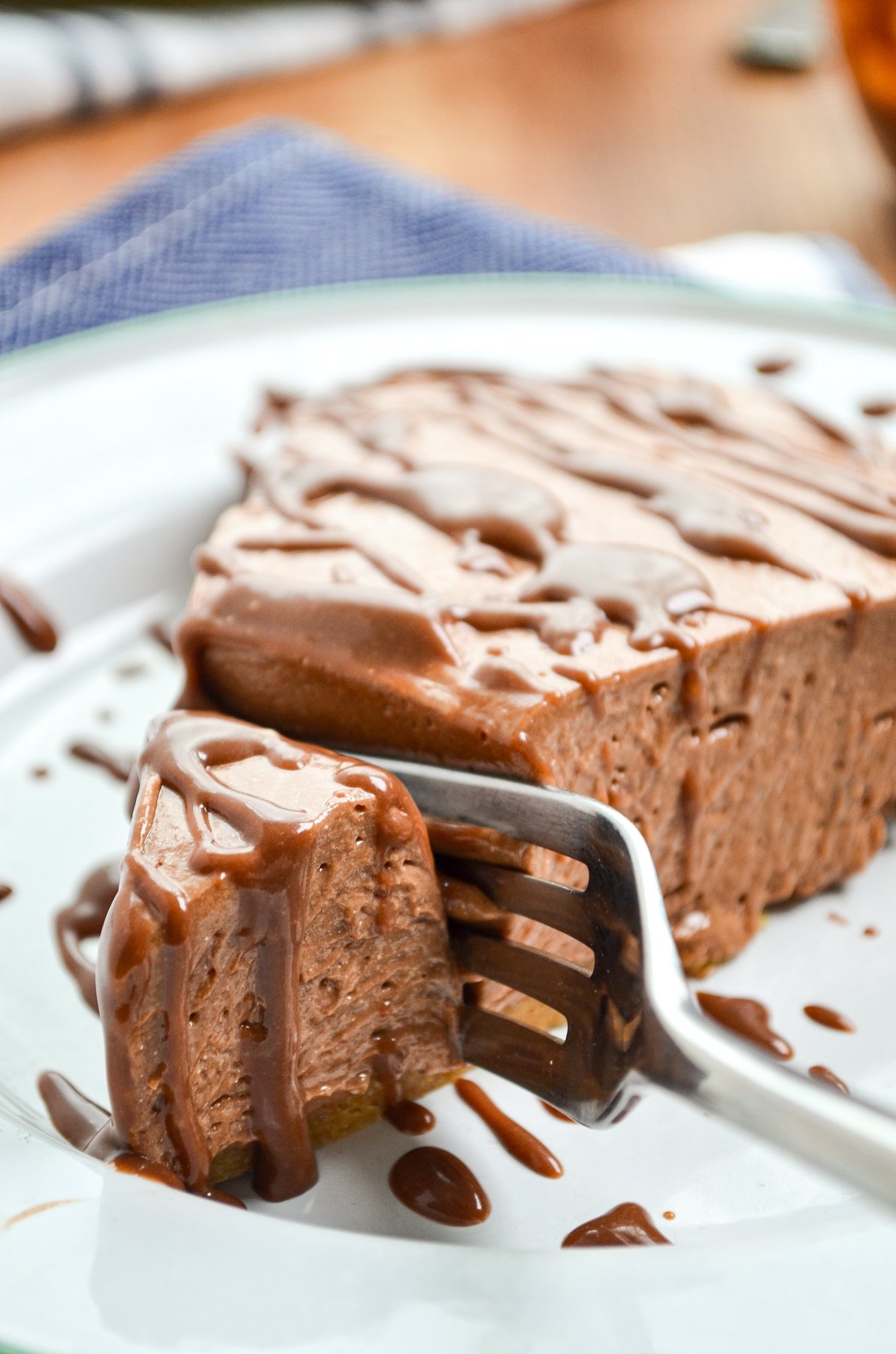 A fork sinking into a creamy slice of No Bake Nutella Pie