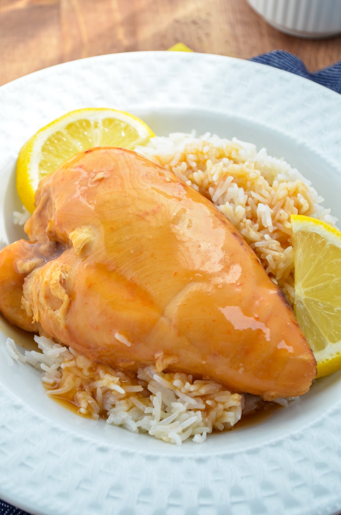 Slow cooker lemonade chicken, served on a bed of rice.