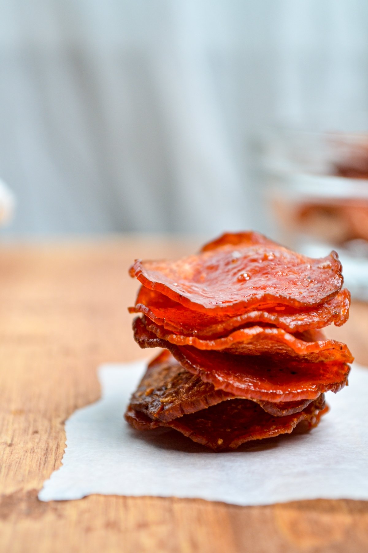 Air fryer pepperoni chips stacked in a tower.