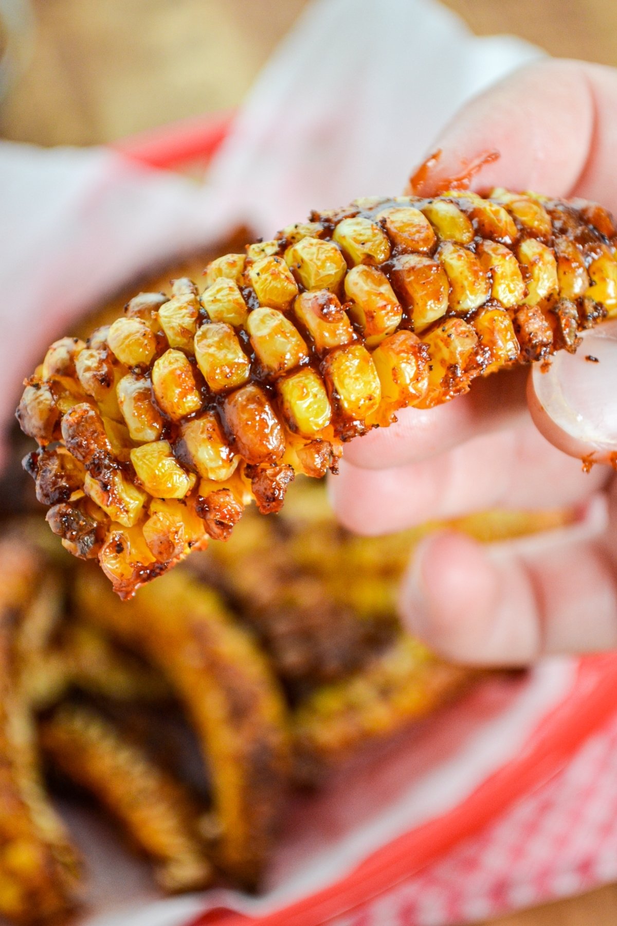 Corn ribs, covered in barbeque sauce.