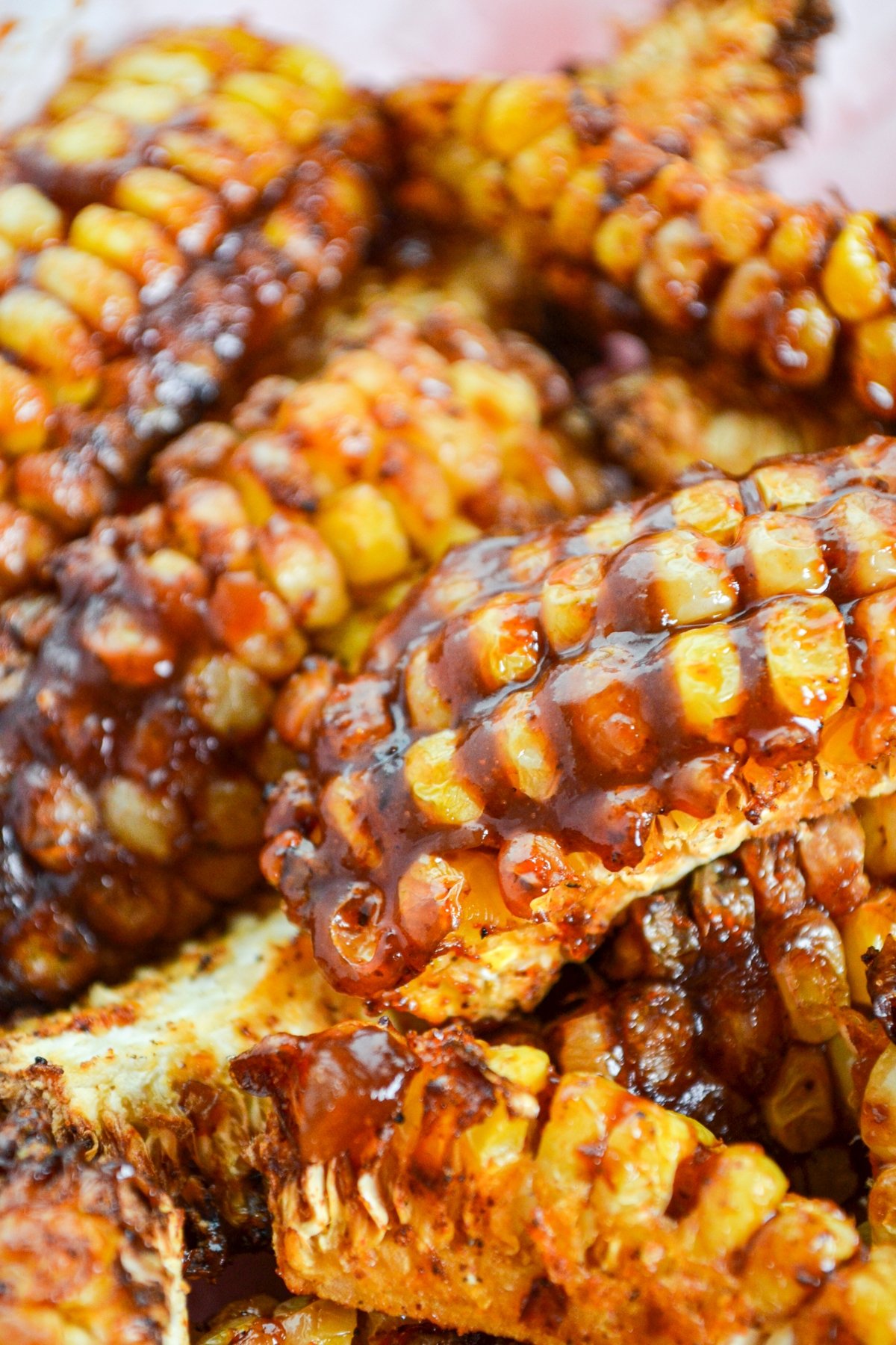 Corn ribs drenched in BBQ sauce.