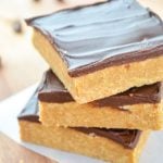 A stack of three no bake peanut butter bars.