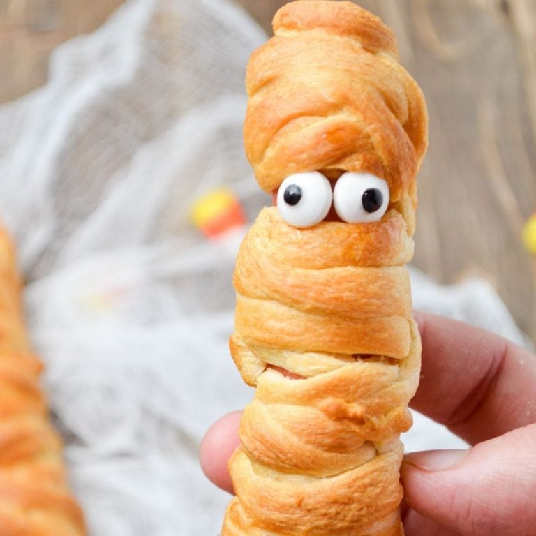 A crescent roll wrapped hot dog, with googly eyes.
