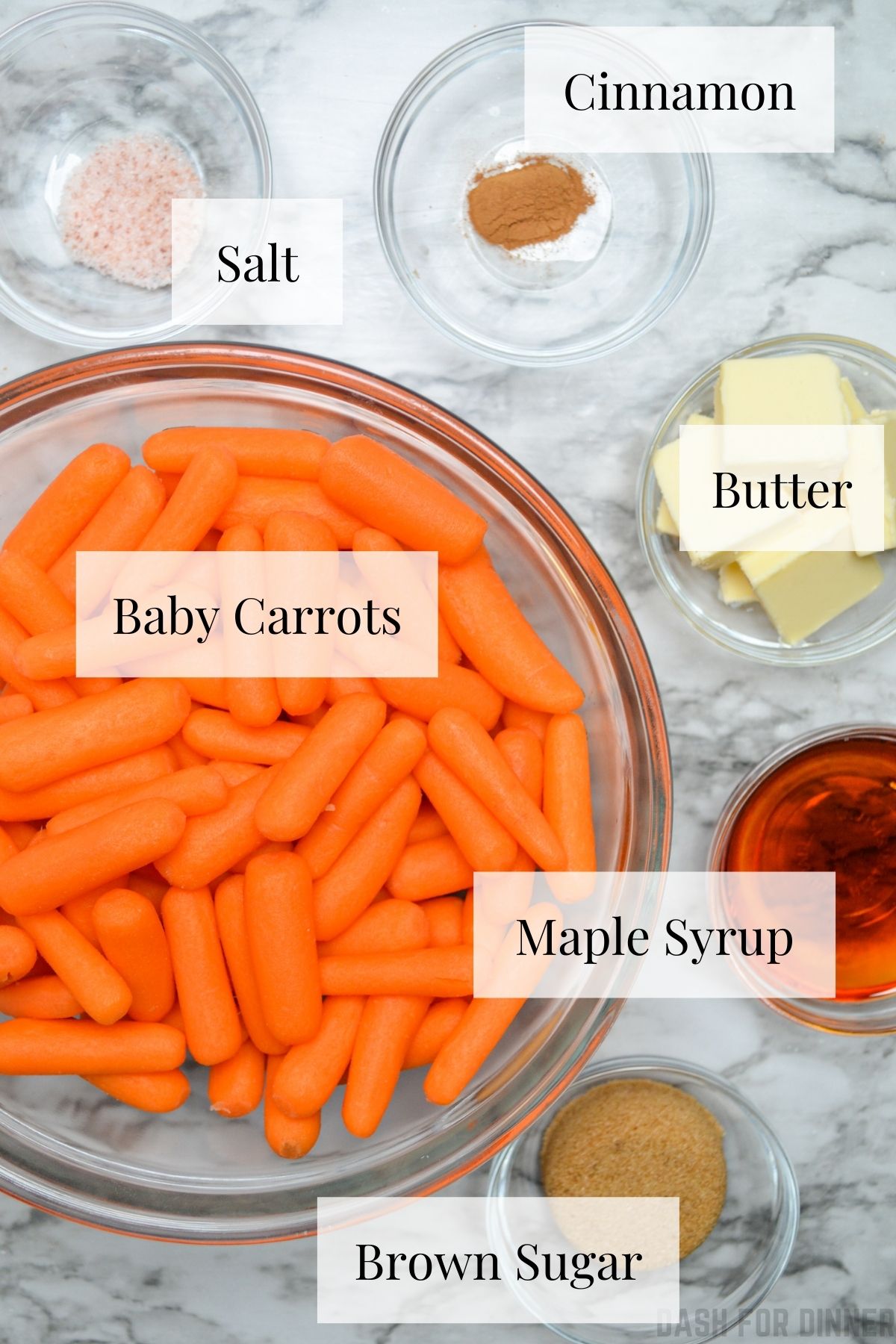 The ingredients needed to make slow cooker maple and brown sugar glazed carrots.