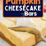 A pumpkin bar topped with whipped cream.