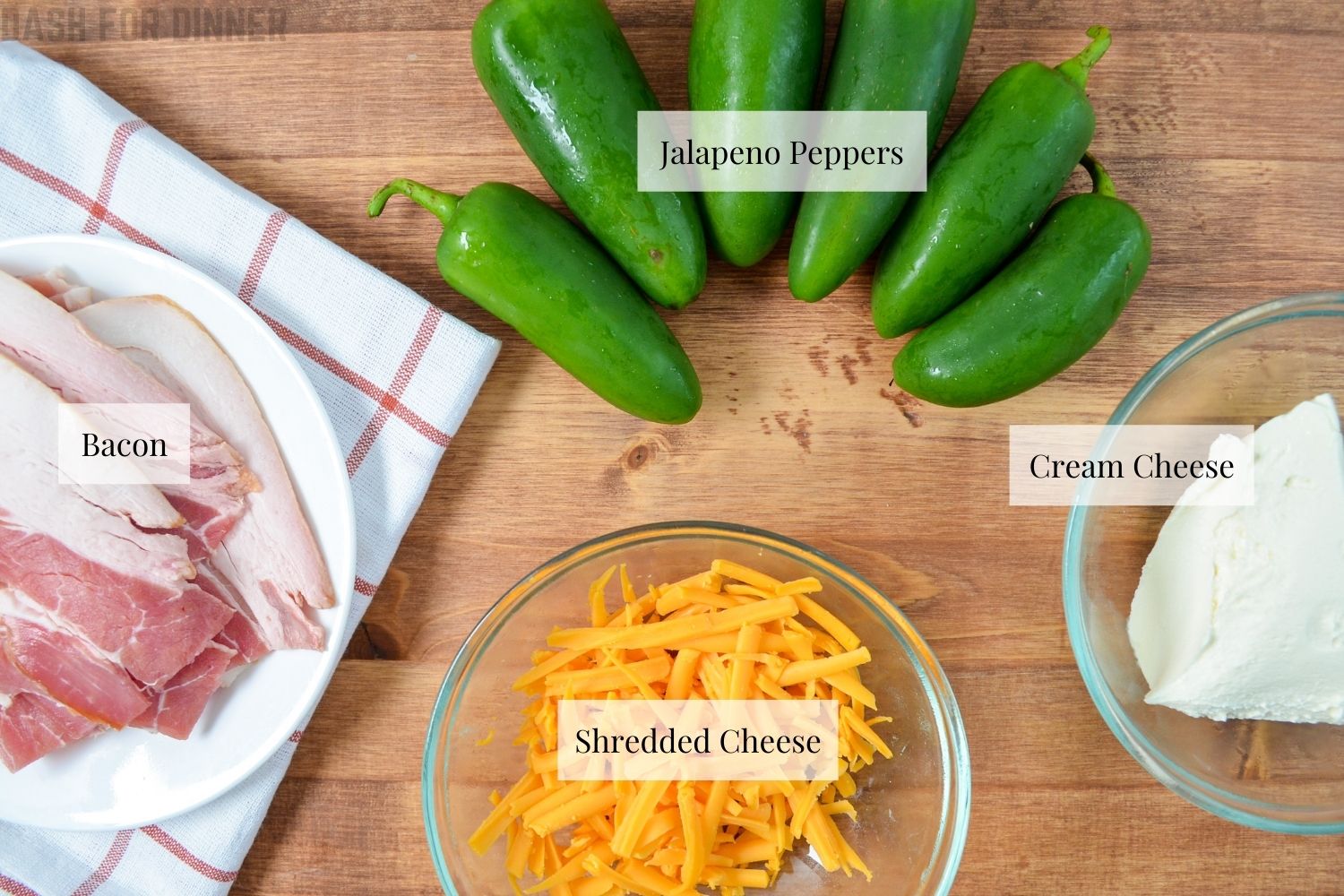 Ingredients needed to make air fryer jalapeno poppers: jalapenos, cheese, cream cheese, and bacon.