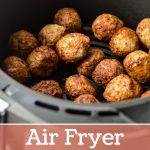 An air fryer basket filled with with cooked meatballs.
