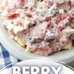 A bowl of fresh berries tossed with whipped cream and cream cheese.