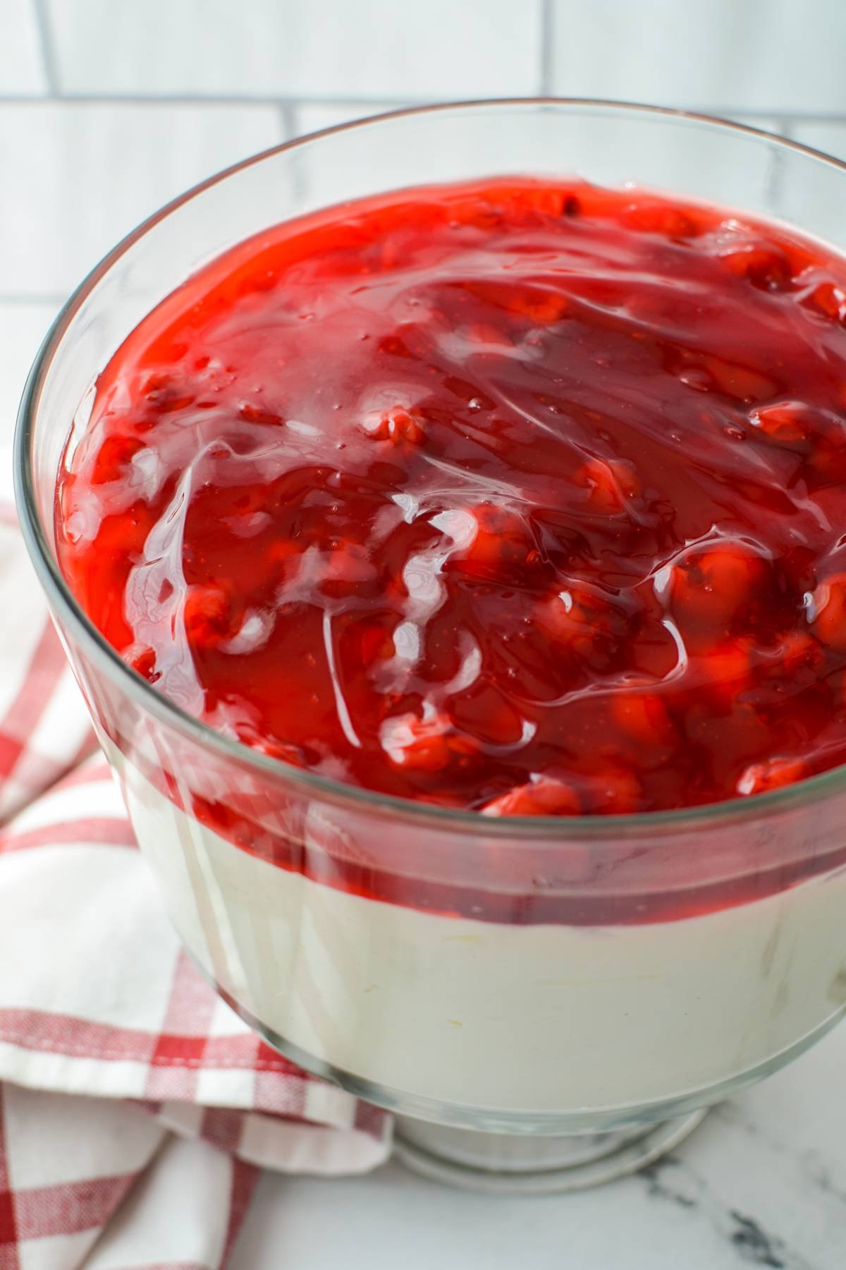 A trifle dish filled with lazy cheesecake salad.