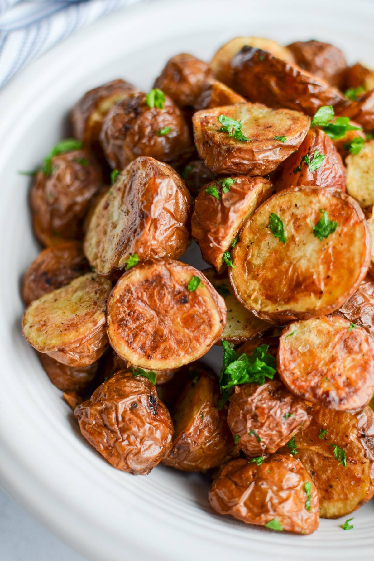 A bowl of roasted baby potatoes.