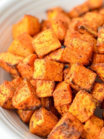 A close up of sweet potato cubes that have been roasted.