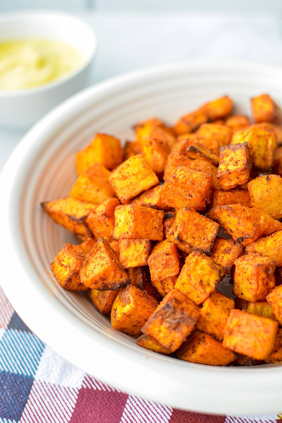 A bowl of air fried sweet potato cubes.