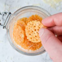 A jar with parmesan crisps inside.