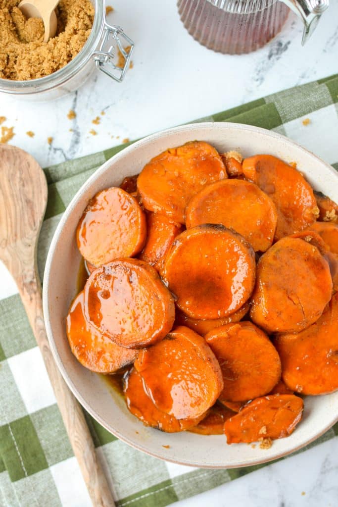 A shallow bowl filled with cooked sweet potato slices.