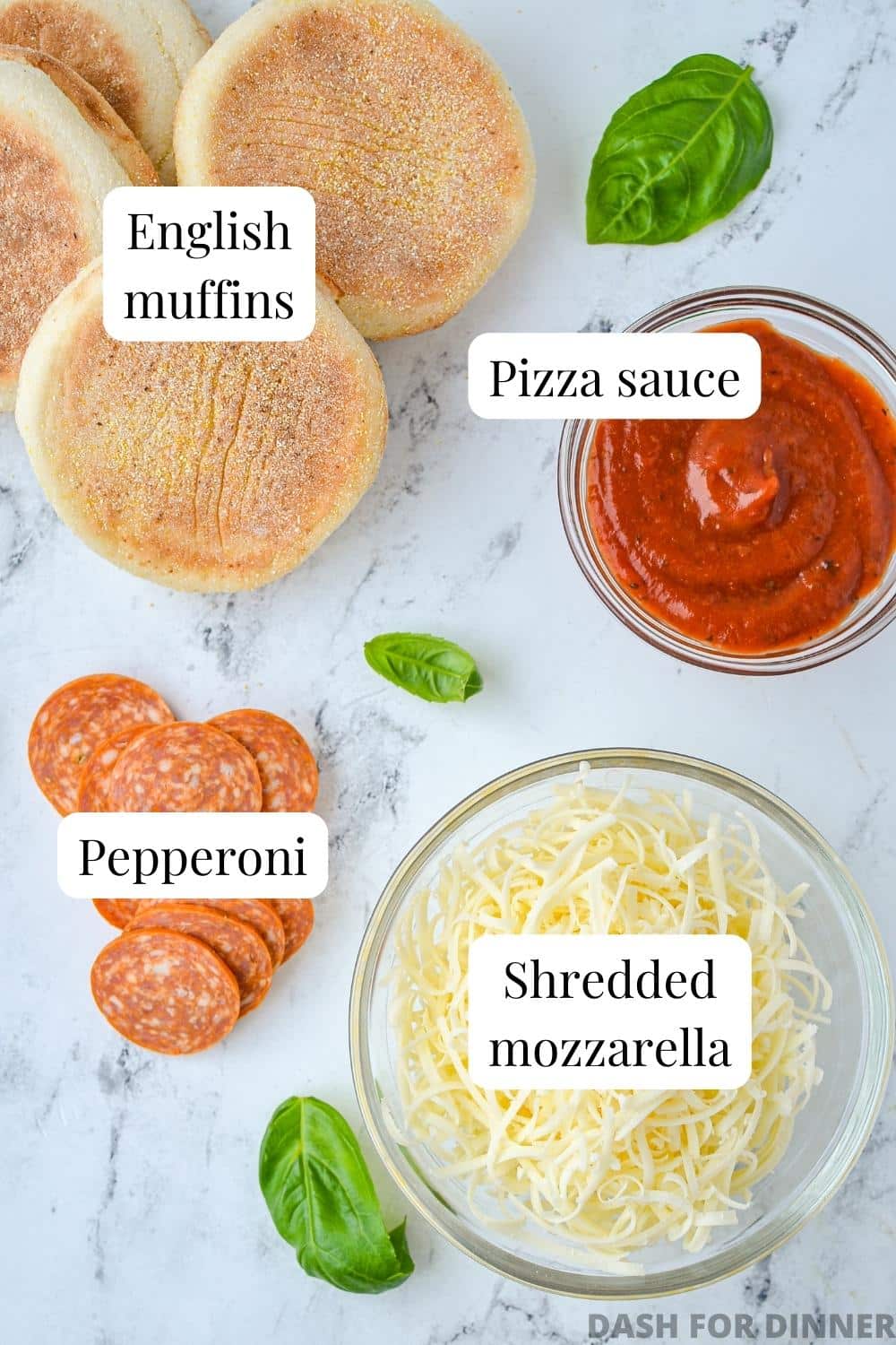 The ingredients needed to make English muffin pizzas, including sauce, pepperoni, and cheese.