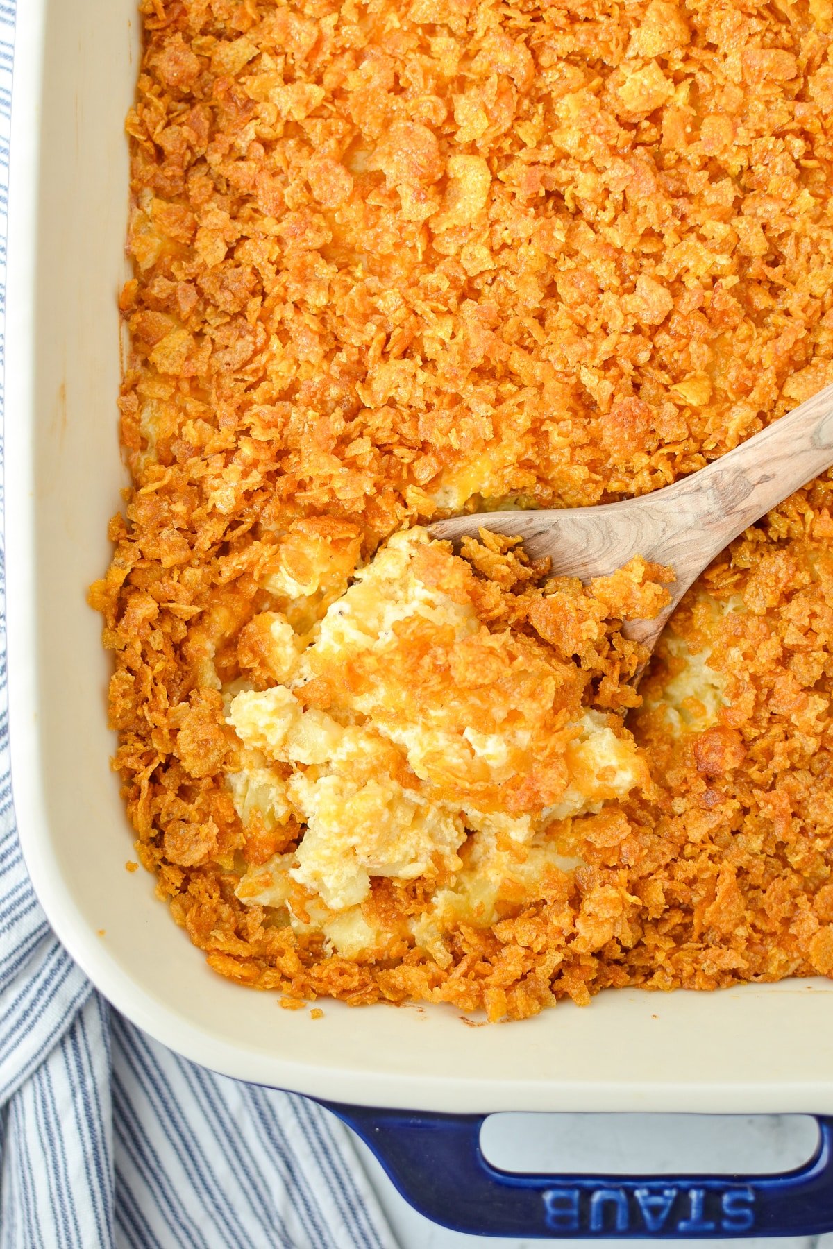 A baking dish with hash brown casserole in it.