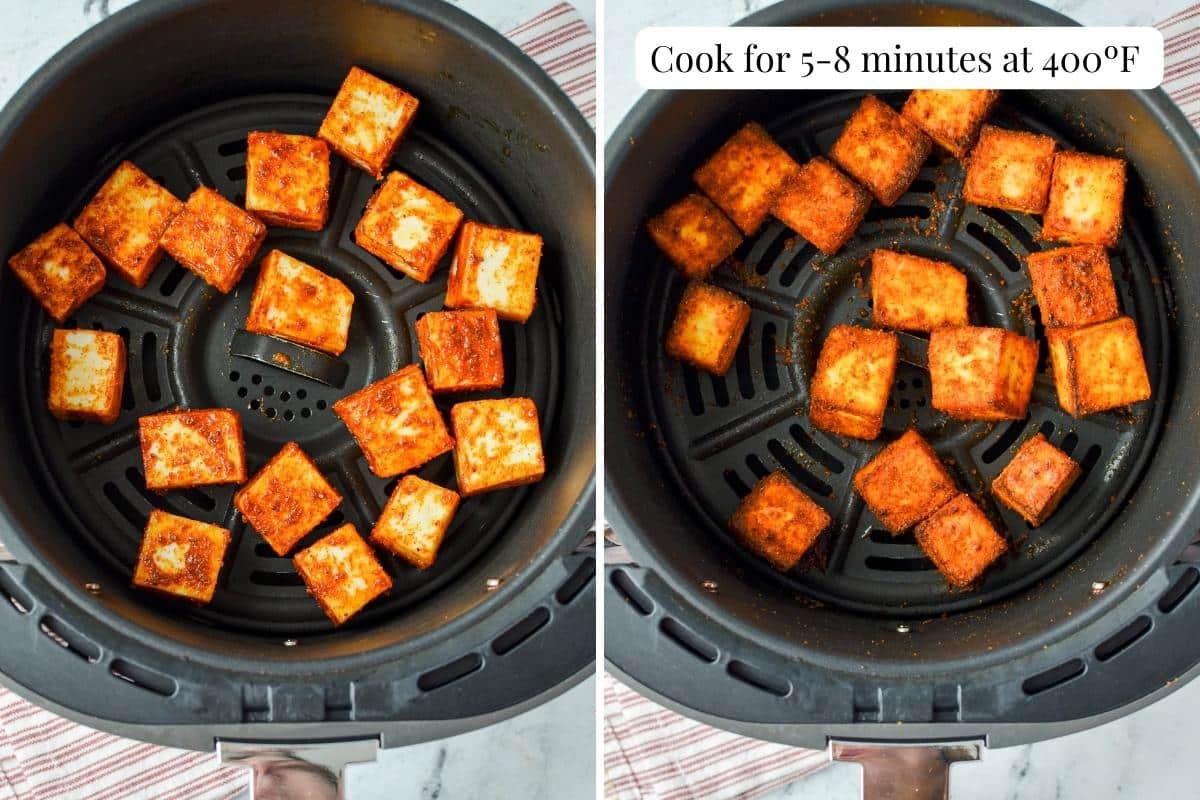 An air fryer basket with seasoned, and then cooked paneer cubes.