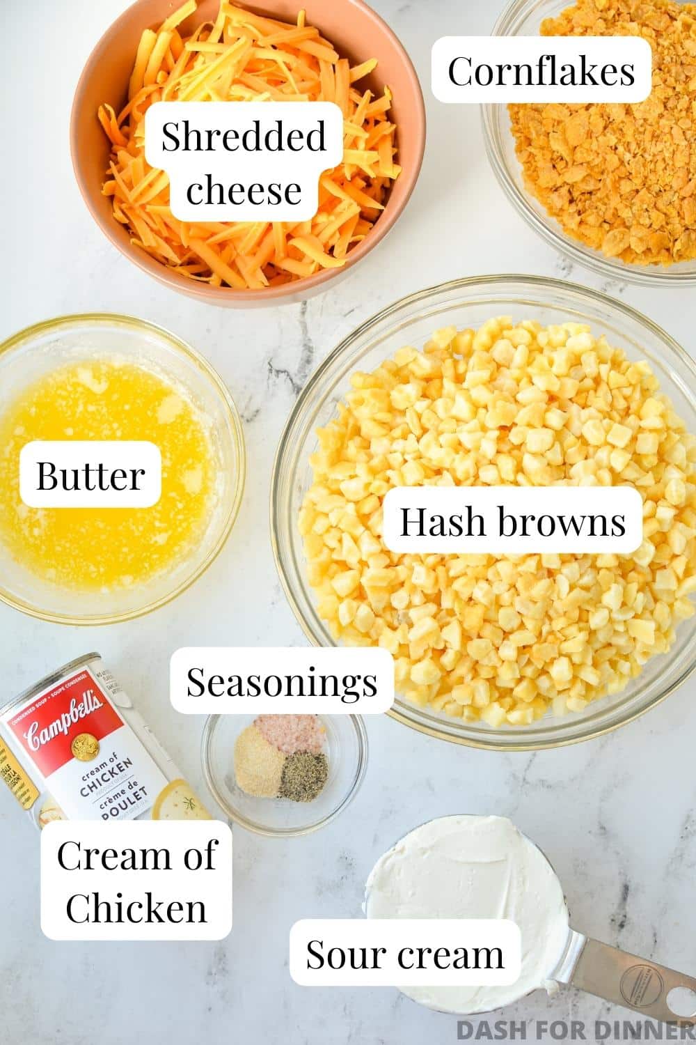 The ingredients needed to make hash brown casserole: hash browns, cheese, butter, etc.