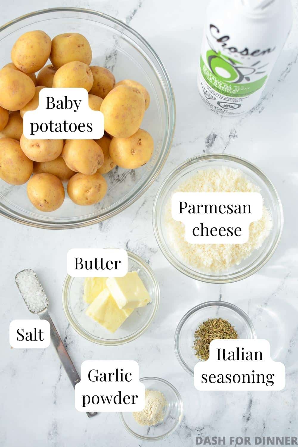 The ingredients needed to make parmesan crusted baby potatoes: baby potatoes, parmesan cheese, butter, Italian seasoning, garlic powder, salt, and cooking spray.