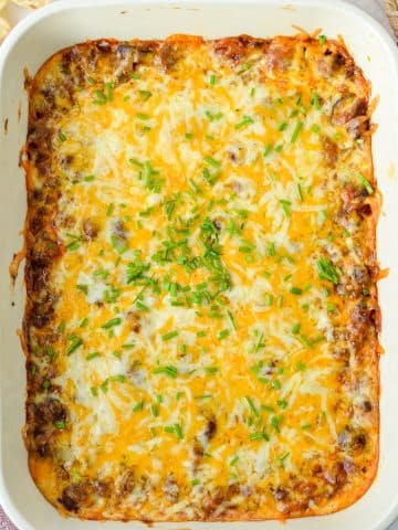 A baking dish filled with a cheesy dip.