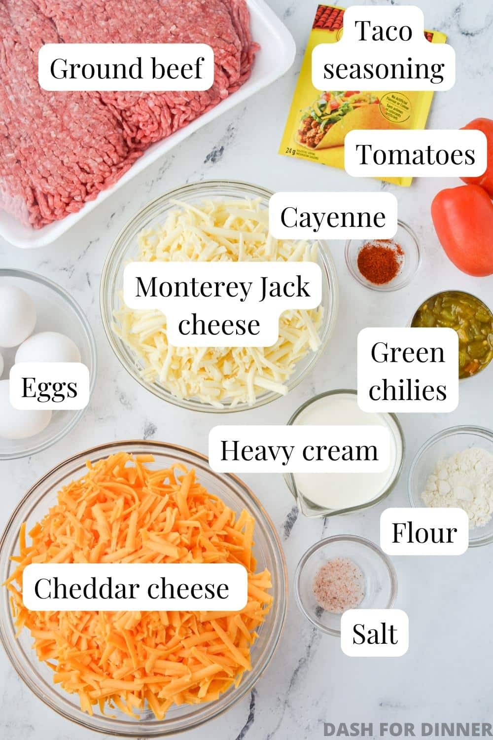 The ingredients to make a cheesy taco casserole: ground beef, cheese, taco seasoning, etc.