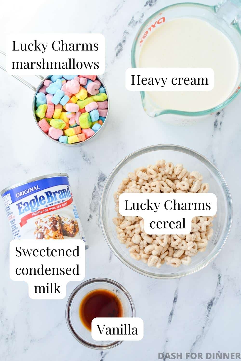 The ingredients needed to make lucky charms ice cream: cereal, heavy cream, sweetened condensed milk, and vanilla.