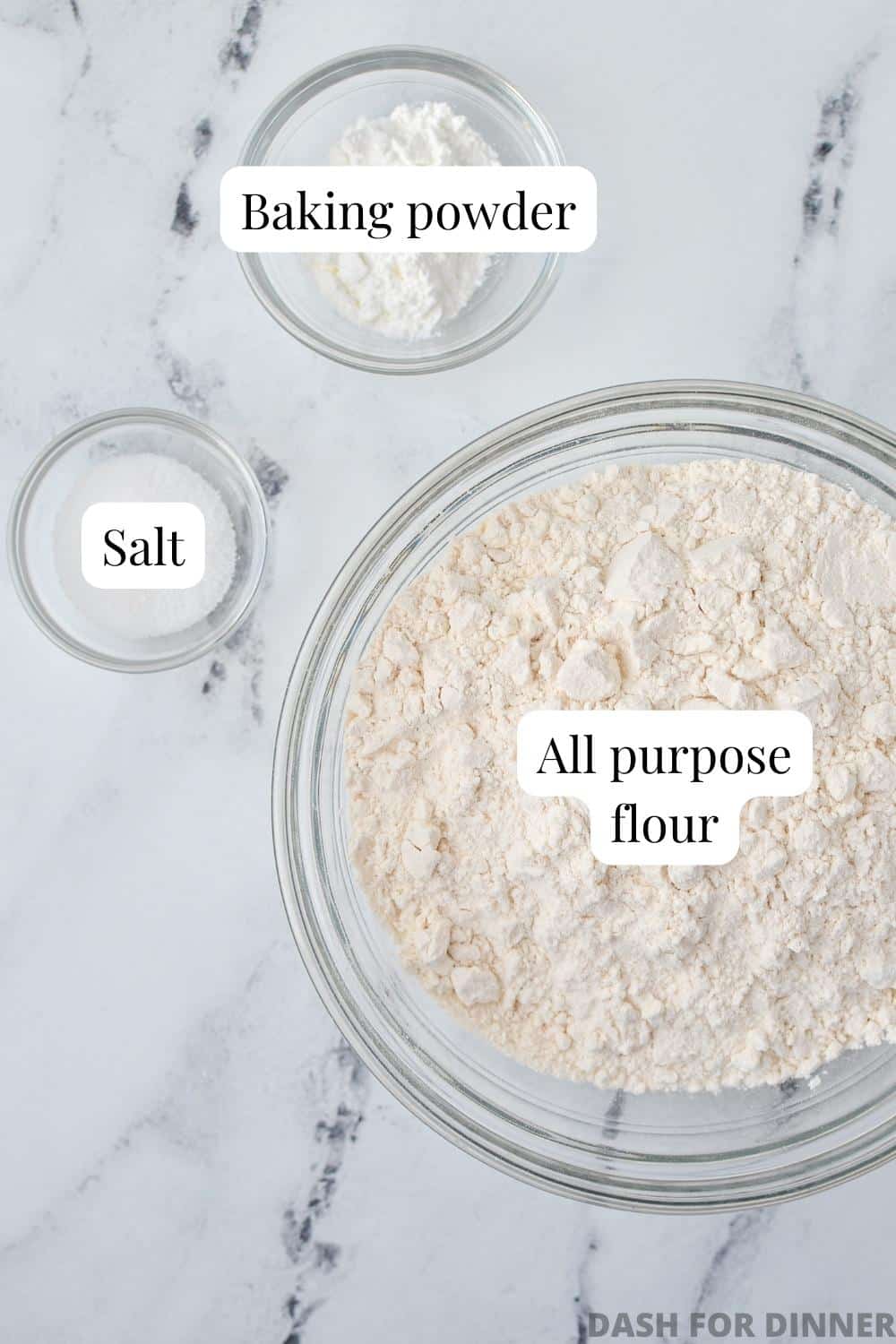 The ingredients needed to make self-rising flour: flour, baking powder, and salt.