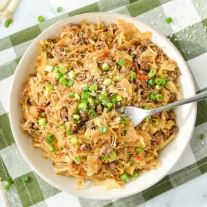 A bowl filled with cabbage and ground beef stir fry.