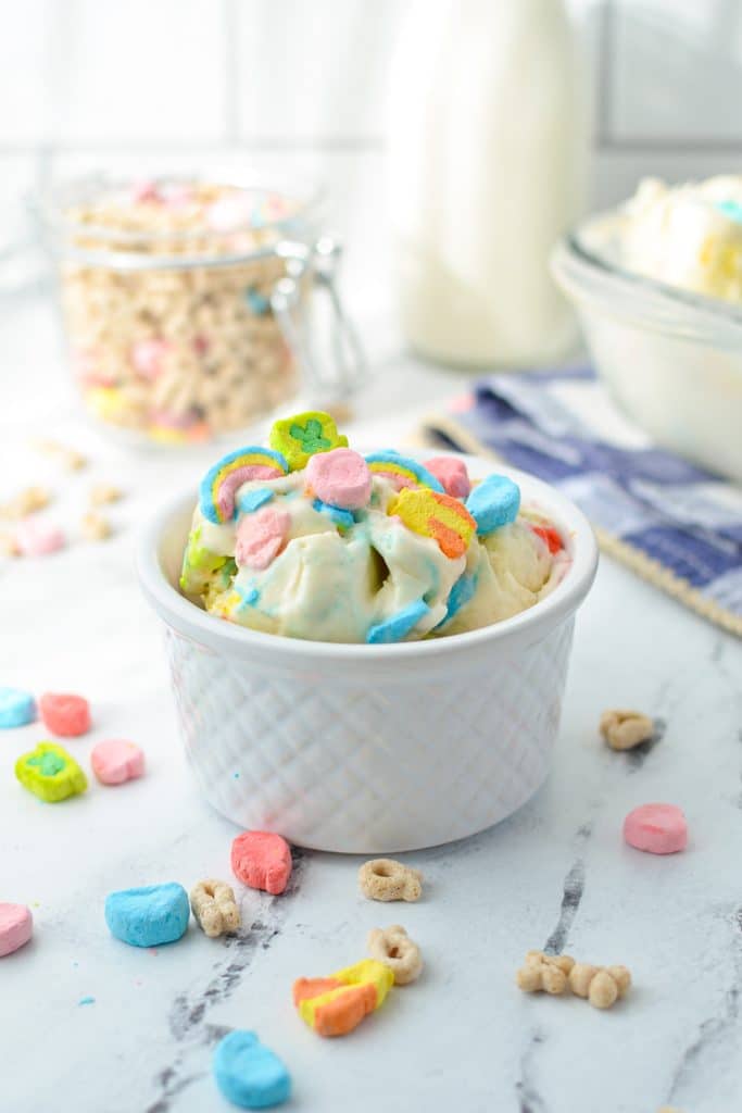A small bowl with ice cream and marshmallows.