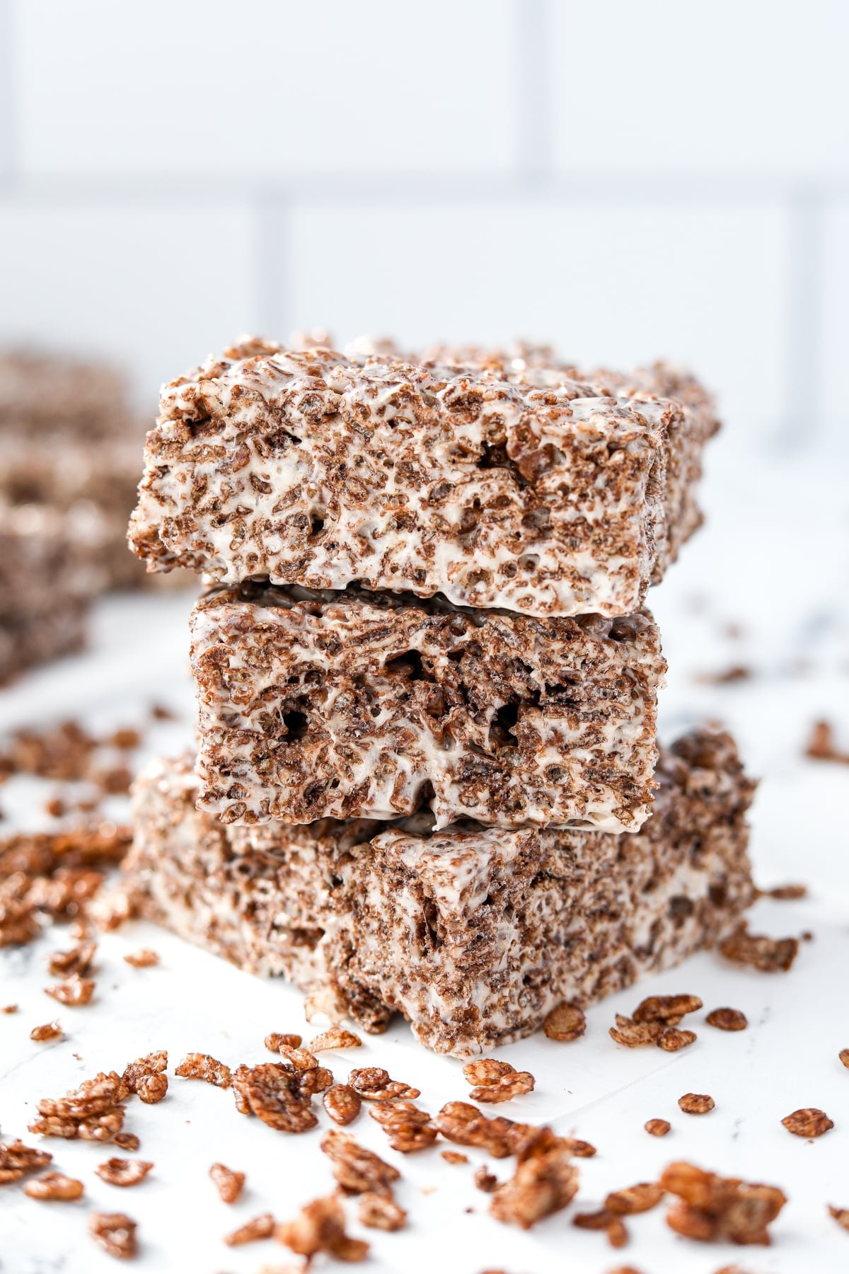 A stack of three cereal treats made with cocoa rice.