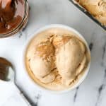 An overhead shot of a small bowl filled with ice cream.