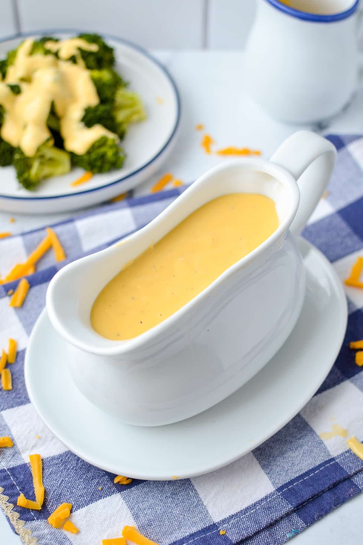 Cheese sauce in a gravy boat.