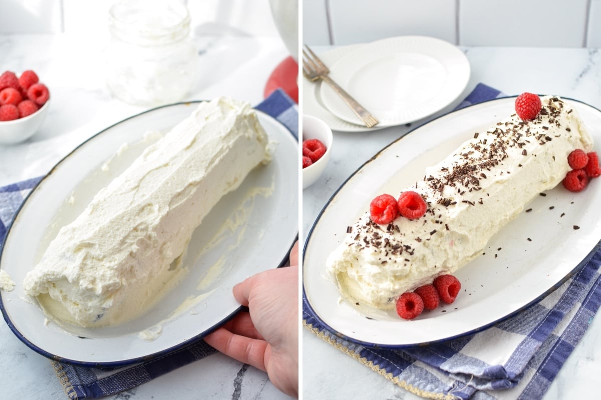 A log covered in whipped cream and garnished with berries and chocolate shavings