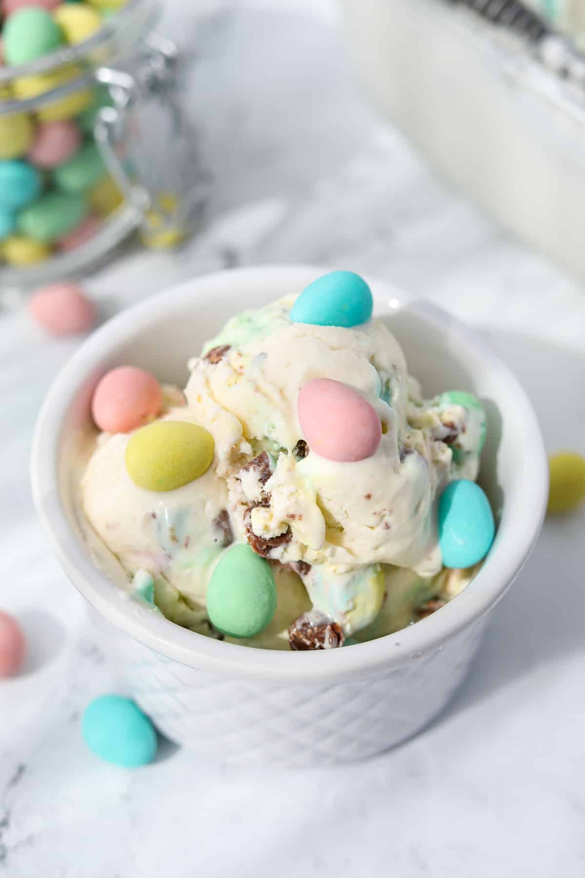 A bowl of mini egg ice cream topped with mini eggs.