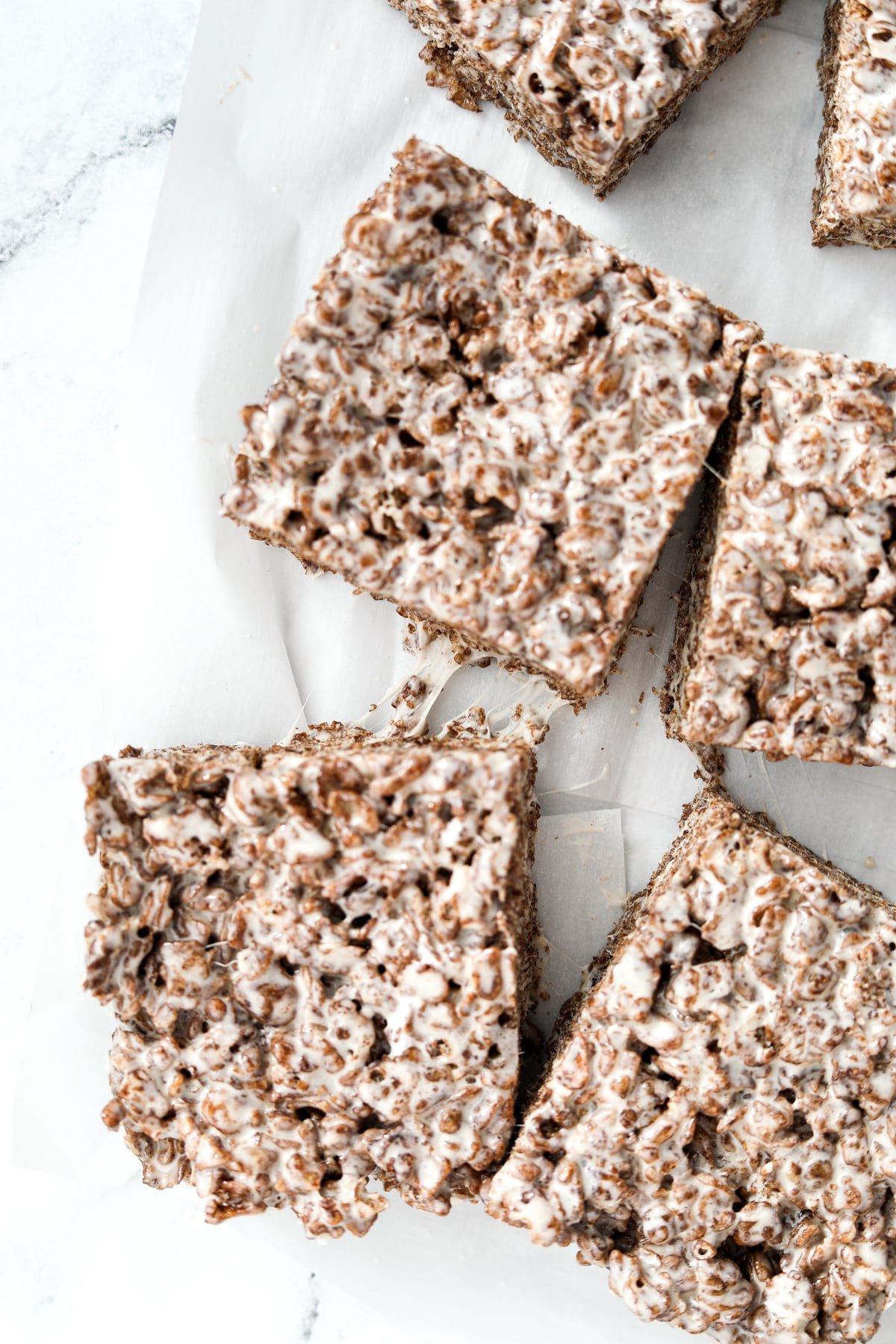 Cocoa pebbles cereal treats cut into bars.