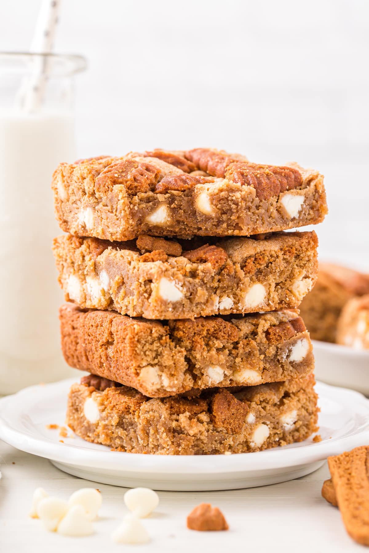 A stack of blondies with white chocolate chips.