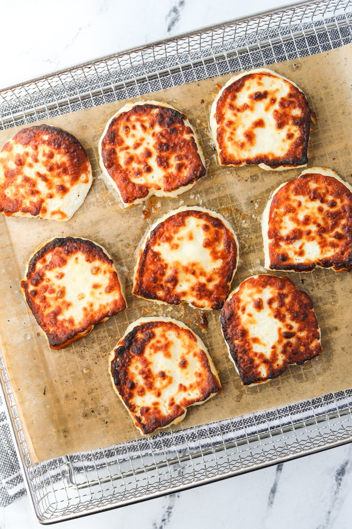 Slices of halloumi cheese that have been air fried.