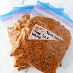 Three freezer bags filled with taco meat.