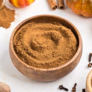 A small wooden bowl of pumpkin spice.