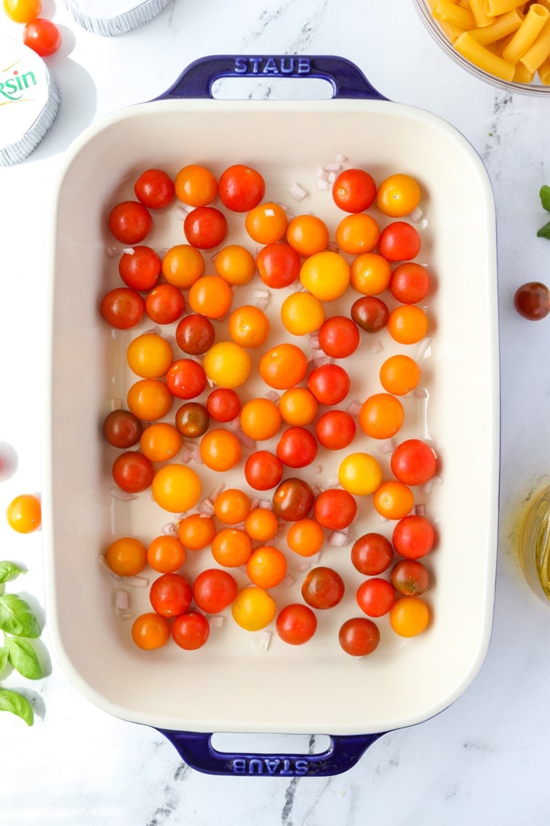 A baking dish filled with cherry tomatoes.