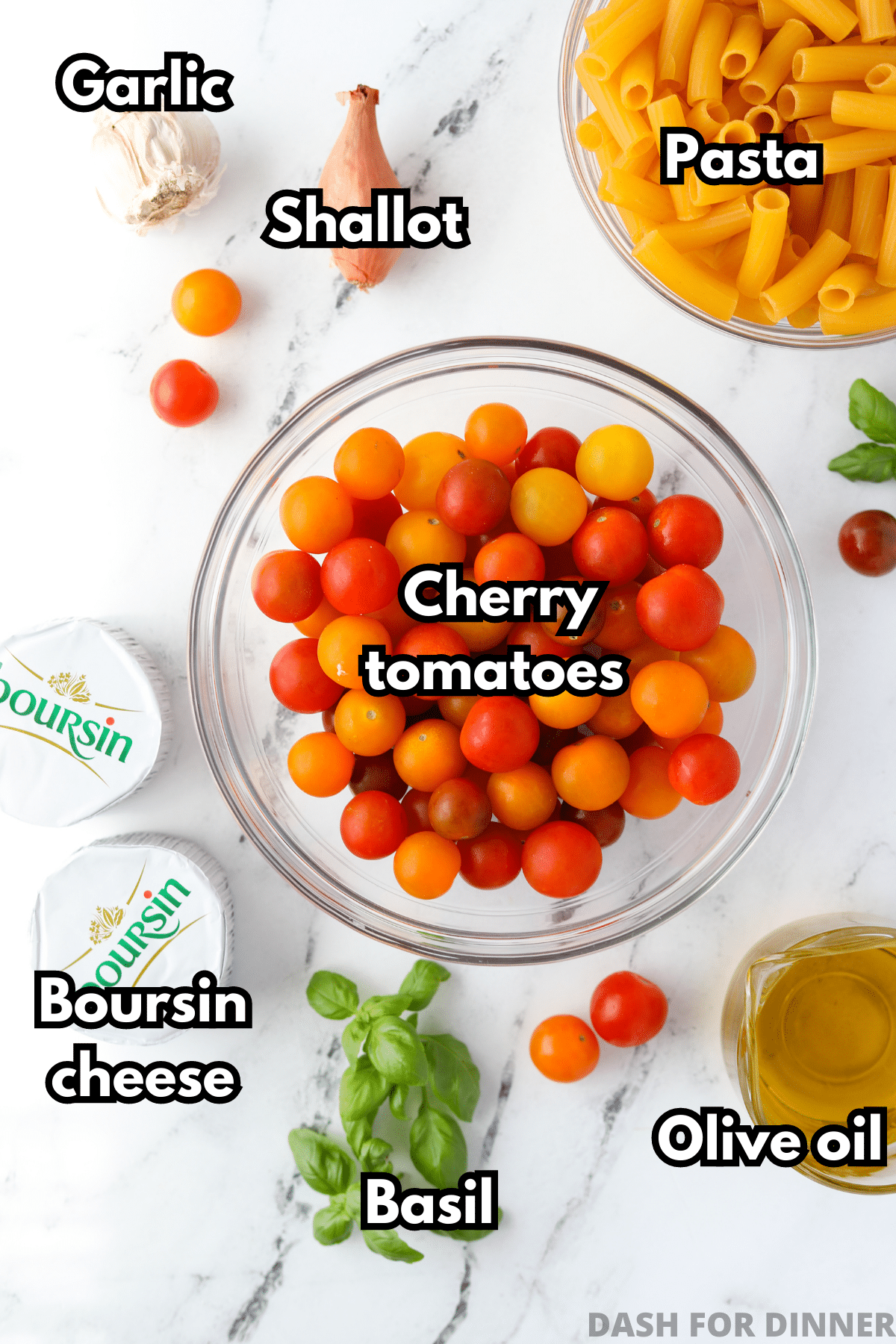 The ingredients needed to make Boursin pasta: cherry tomatoes, pasta, Boursin, basil, etc.