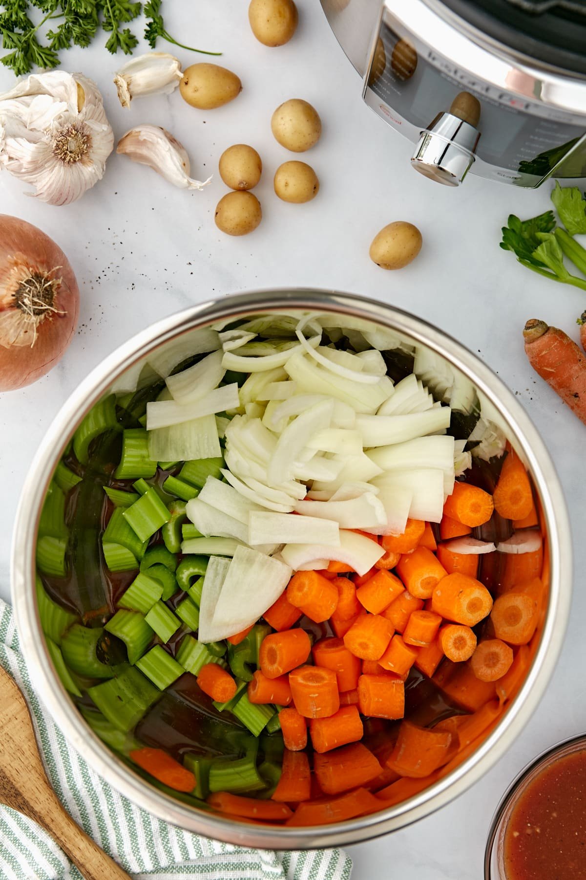 An Instant Pot filled with vegetables.