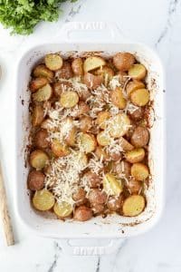 Roasted potatoes with shredded parmesan cheese on top.
