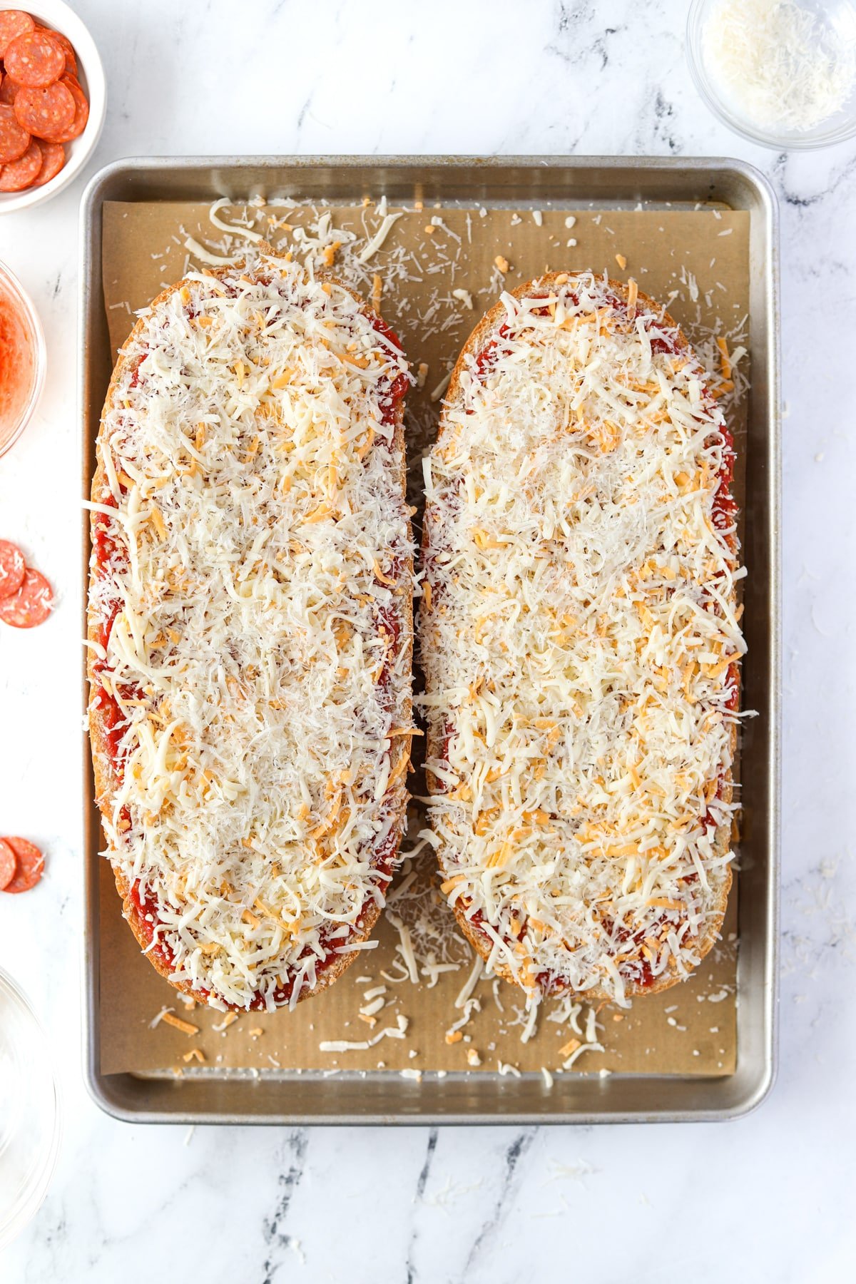French bread topped with shredded cheese.